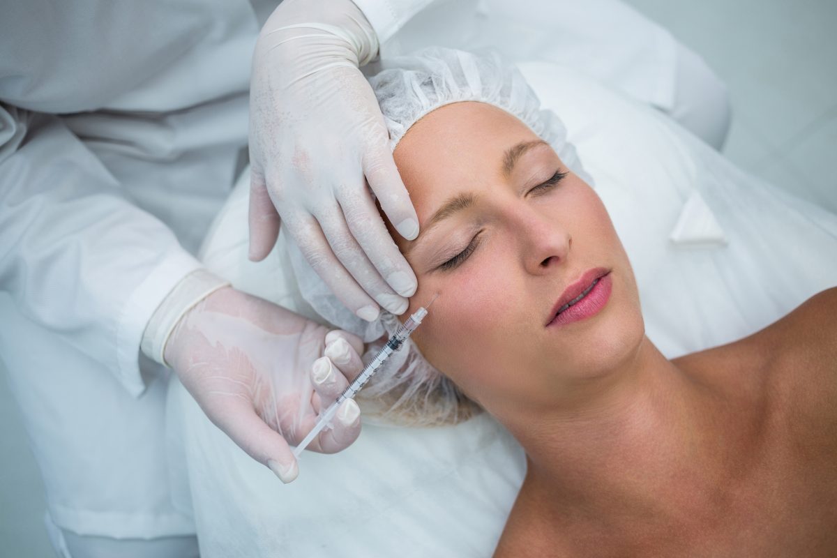 female patient receiving botox injection face