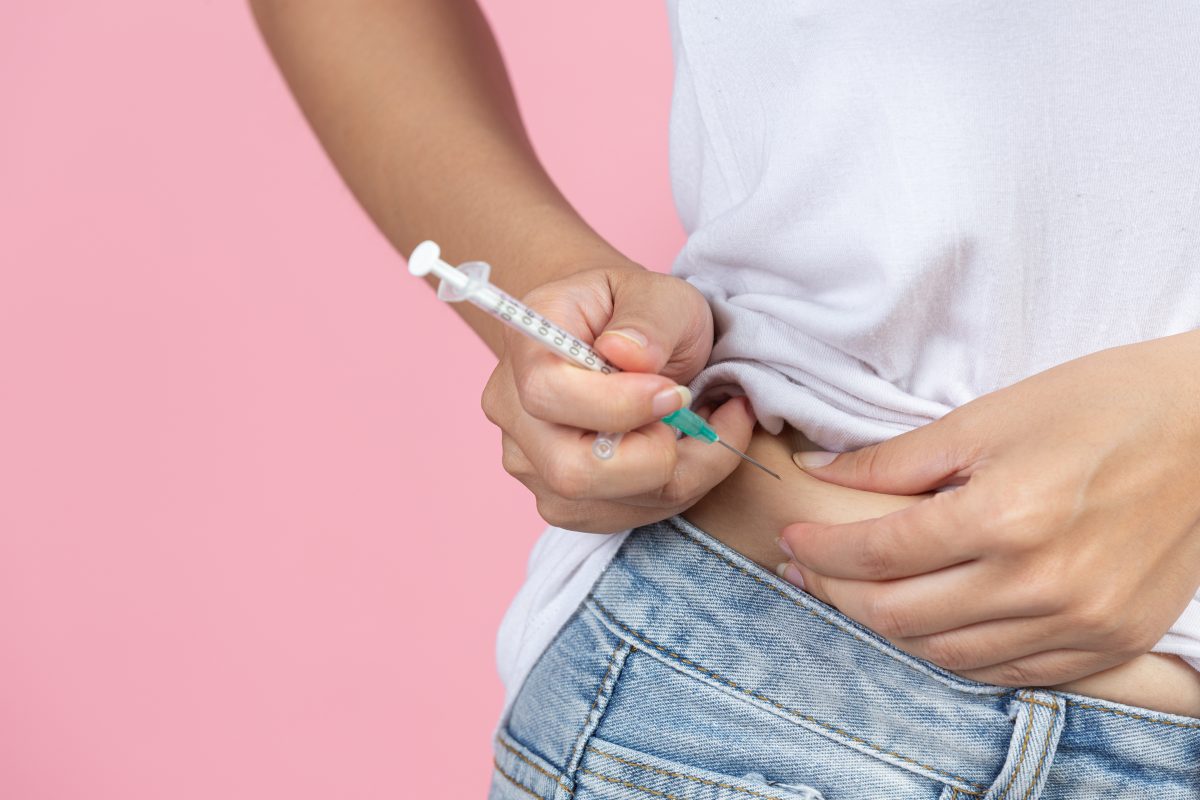 world diabetes day close up picture using medical device check glucose blood